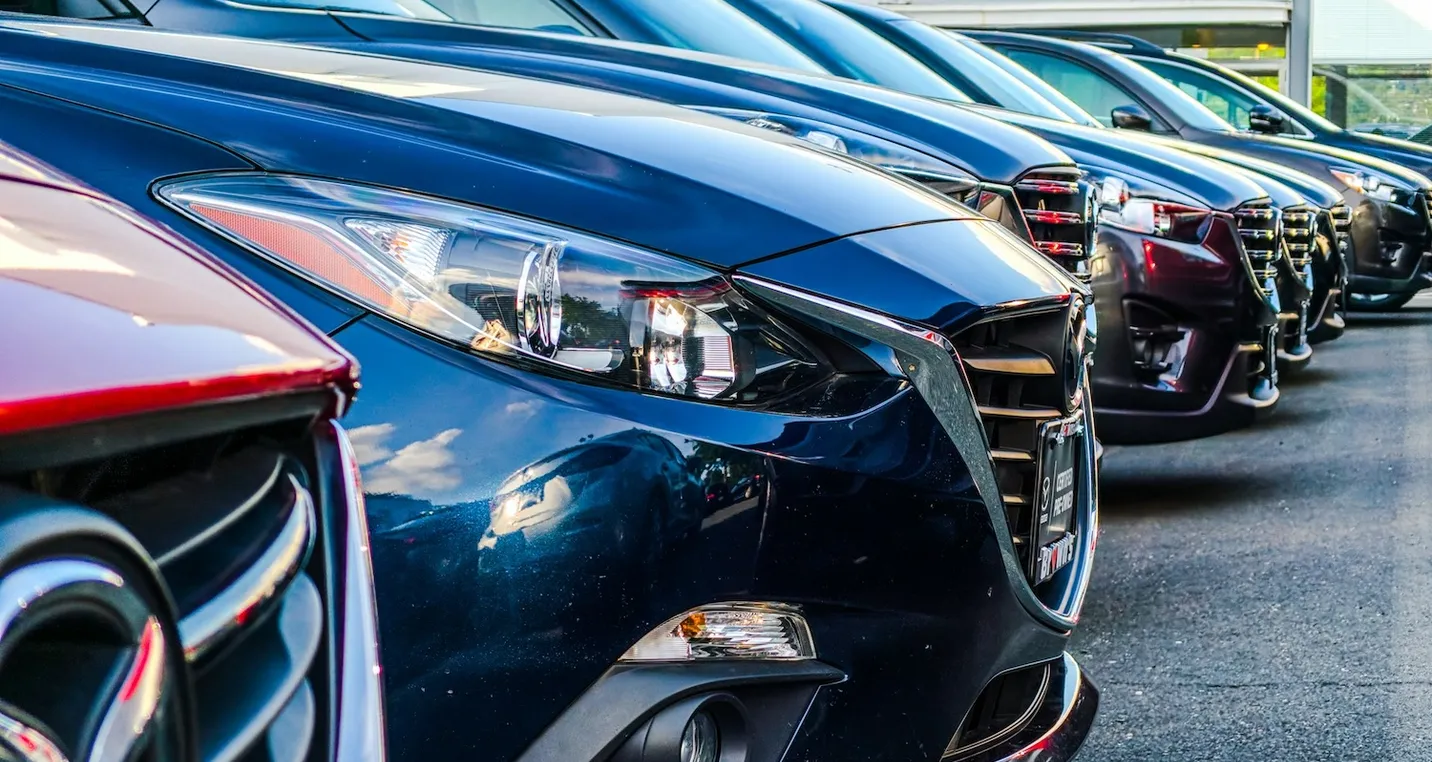 Commercial cars parked in a parking lot