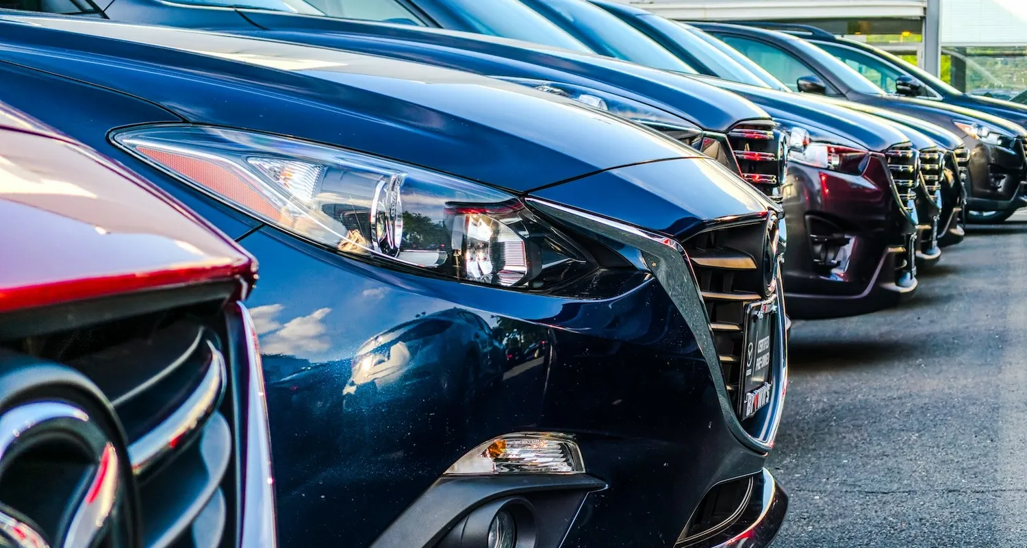 Commercial cars parked in a parking lot