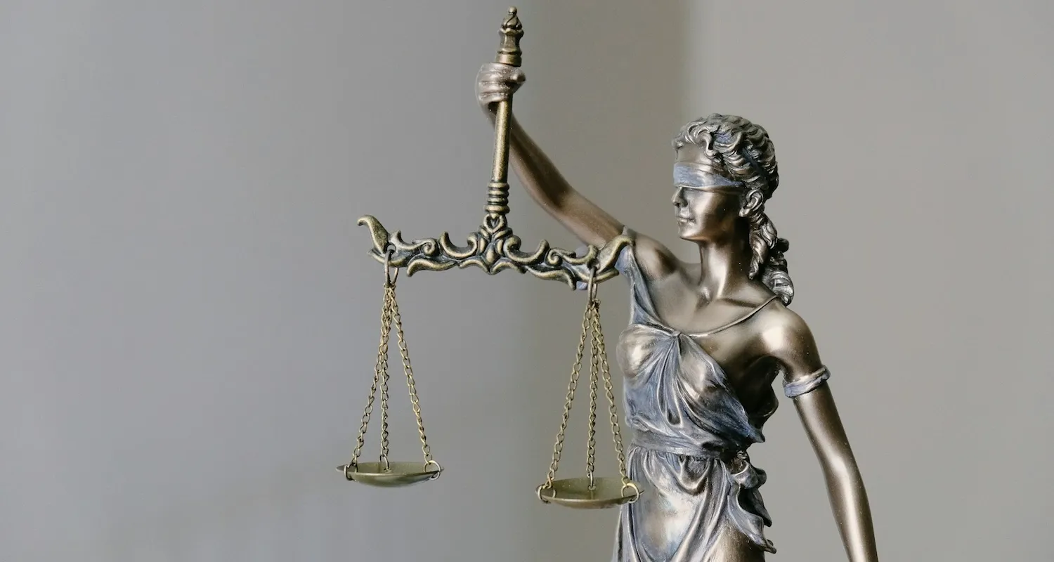 A Statue of Lady Justice holding a sword and scales, symbolizing justice and fairness